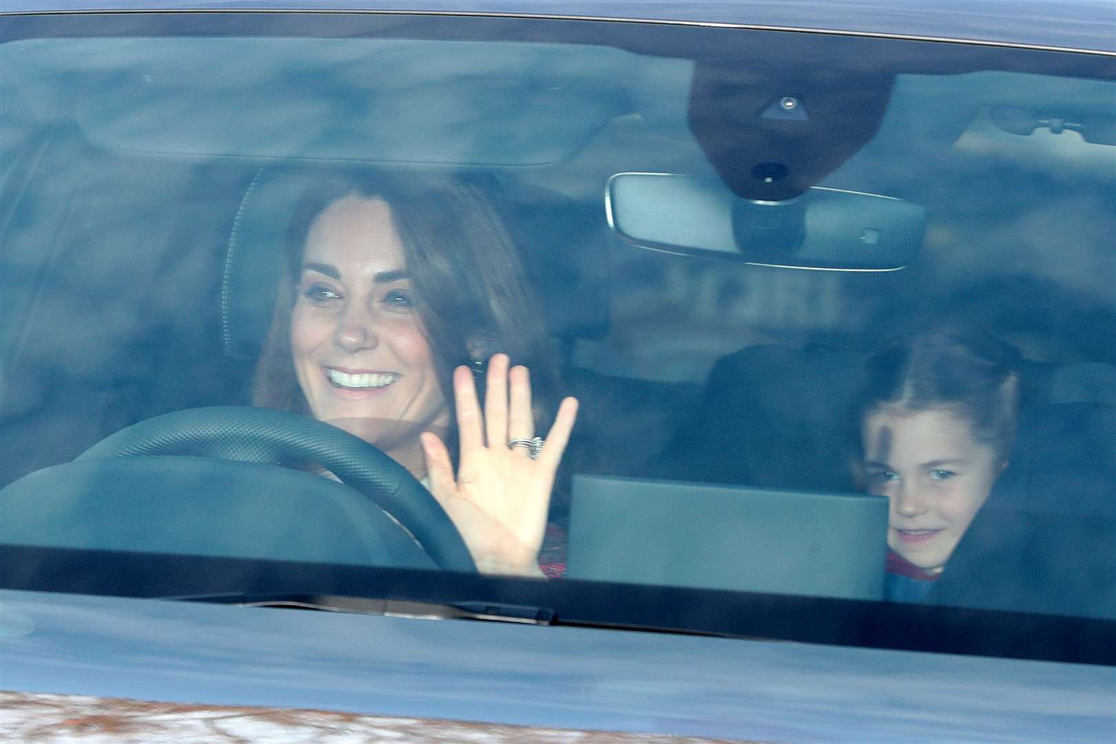 Kate with Charlotte arriving at the Queen’s Christmas lunch (Aaron Chown/PA)