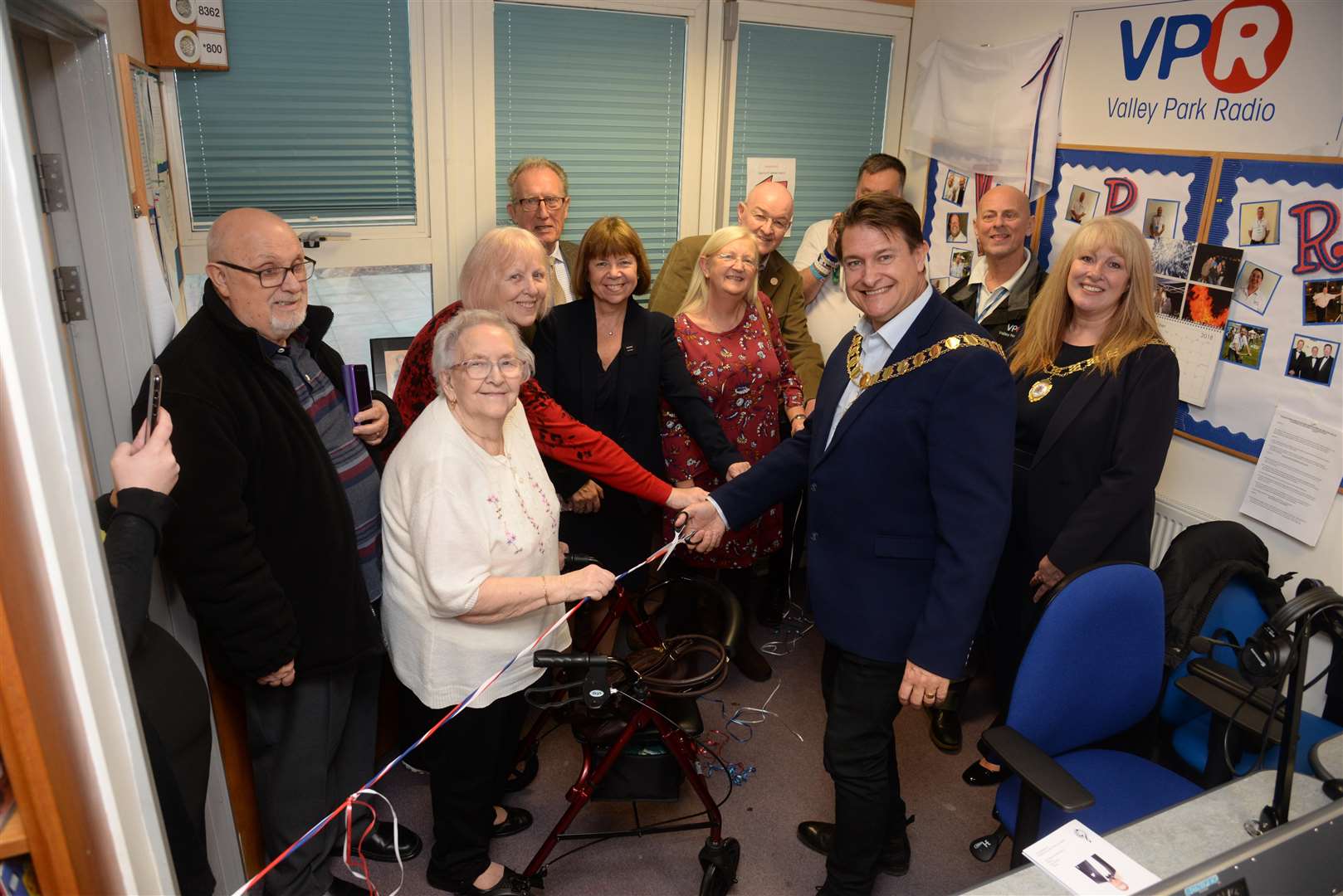 Watched by the family of David Reynolds, Mayor of Dartford Cllr David Mote opening the new studio, picture Chris Davey. (5704734)