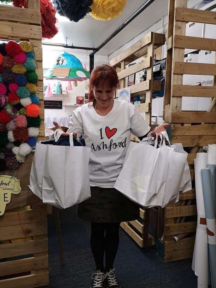 Co-founder Sarah Mabb with bags of PPE that the group created