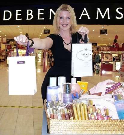 Lucy Moat from Debenhams with some of the raffle prizes and godie bags the store is donating to support the KE Big Quiz.