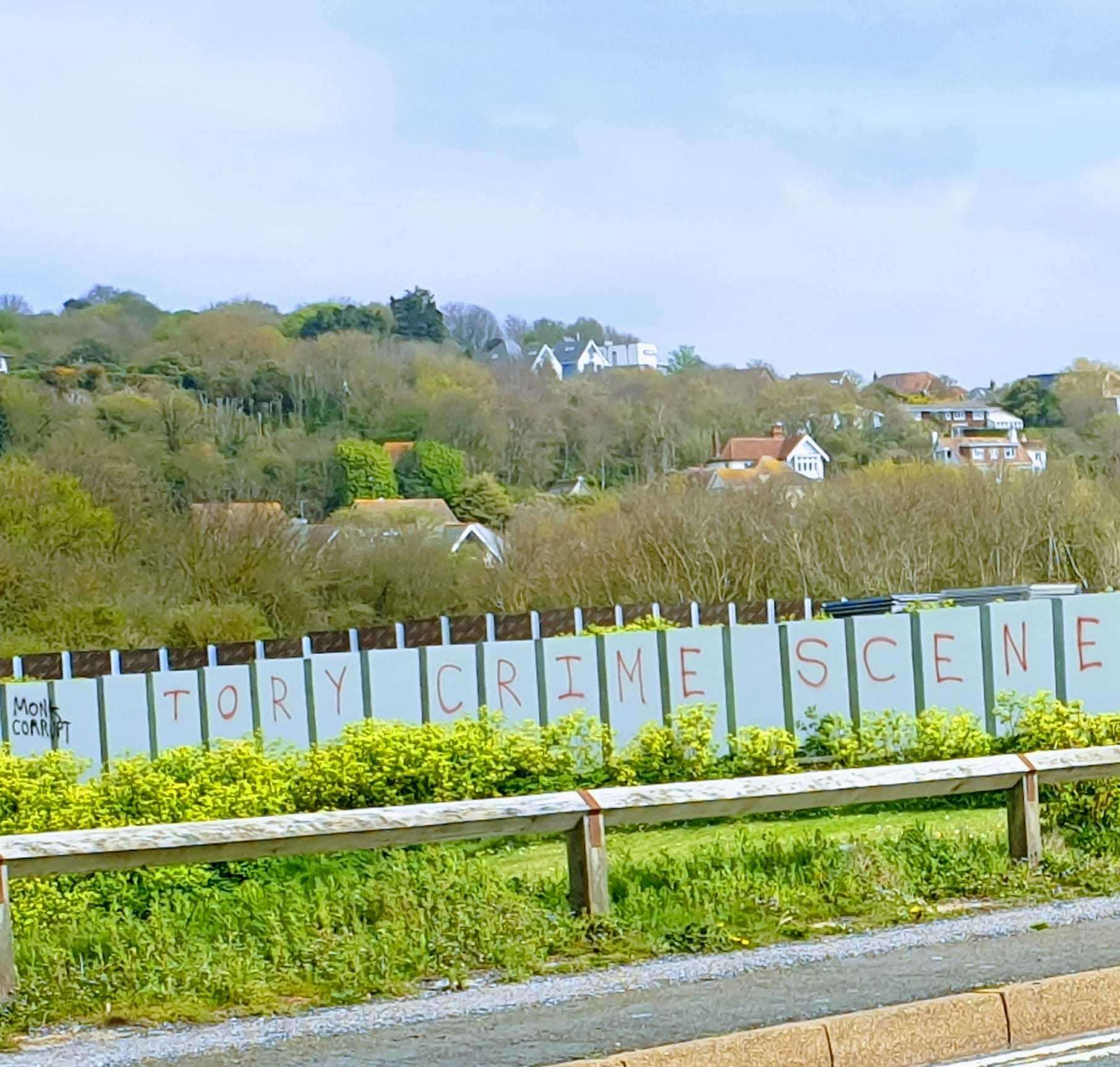 A slogan opposing the Princes Parade scheme was sprayed on hoardings around the seaside development. Picture: Chris Lucas