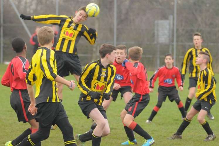 Rainham Eagles, yellow and black, in aerial combat against Rainham Kenilworth under-14s in the League Cup. Picture: Steve Crispe