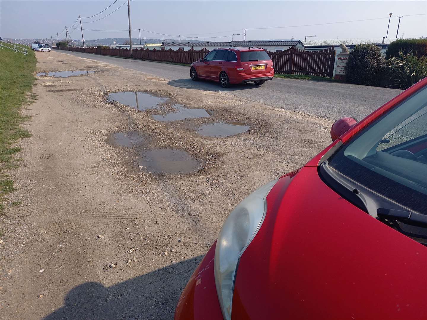 Large potholes still litter the car park