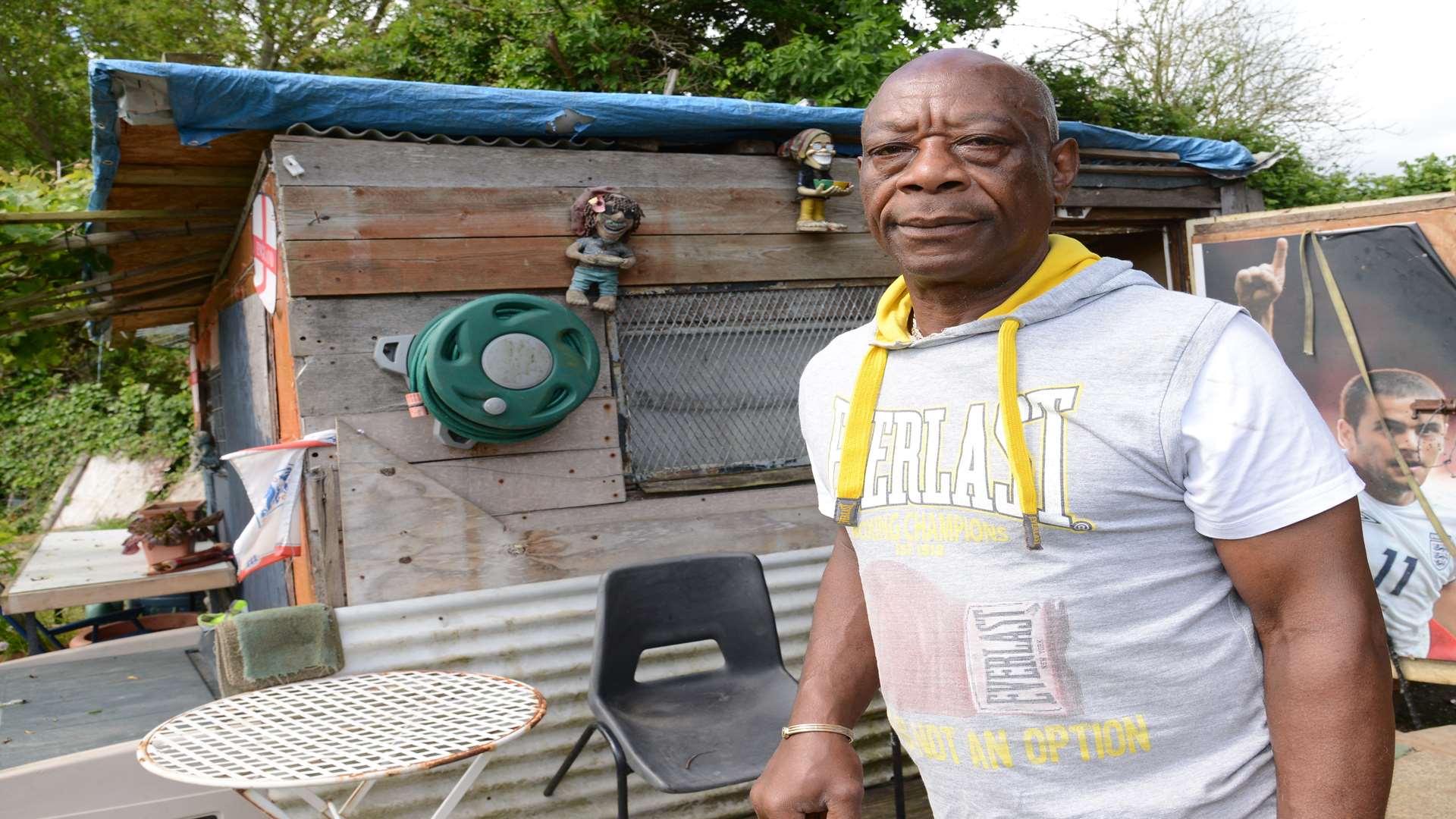 Randal Lilly next to the shed he has lived in on and off since 2013