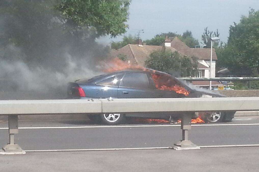 Thick black smoke poured from the car. Picture @StephenPDavies on Twitter