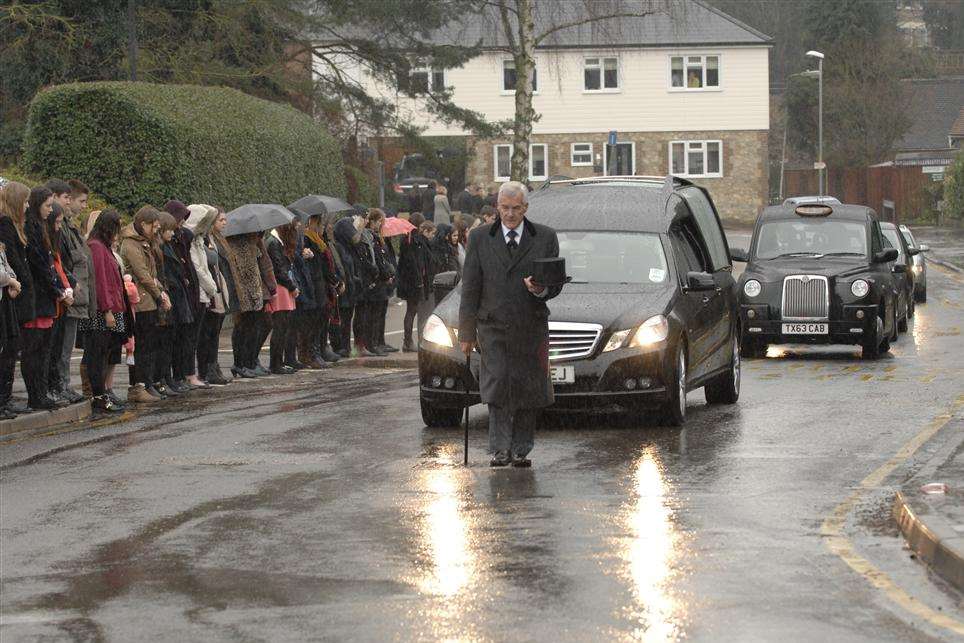 Mourners gather as the funeral procession for Zoe Georgiou passes