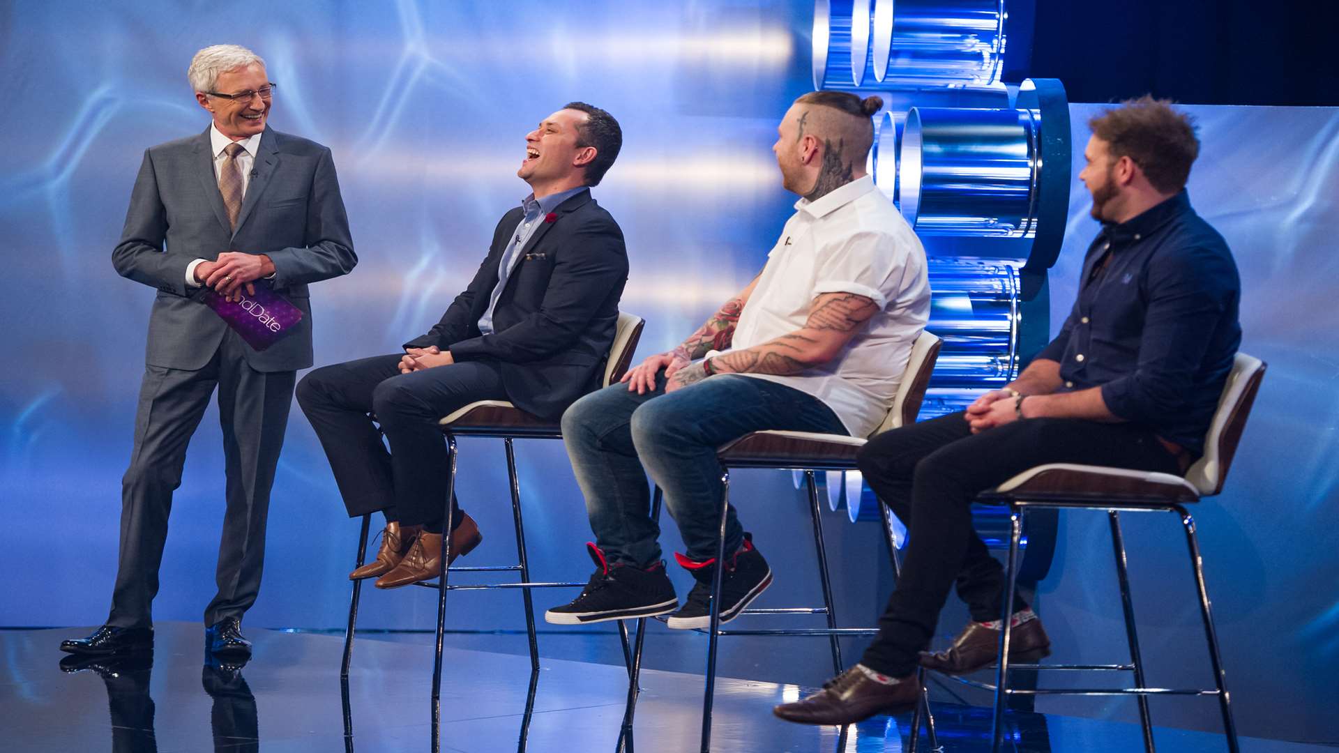 Paul O'Grady with some of the male contestants