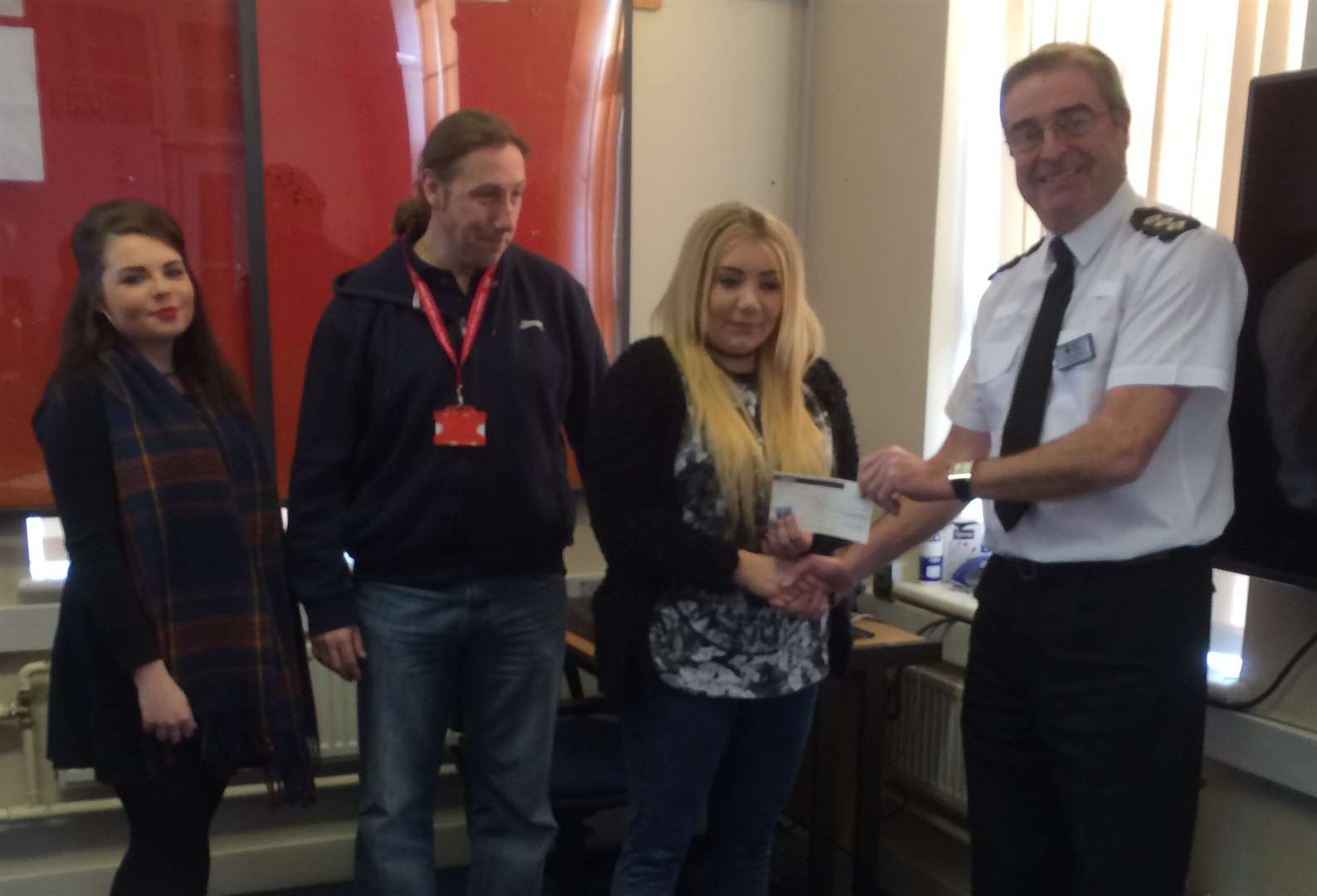 District commander ch insp Steve Barlow with Colin Gibbs and two representatives from Stonham Housing