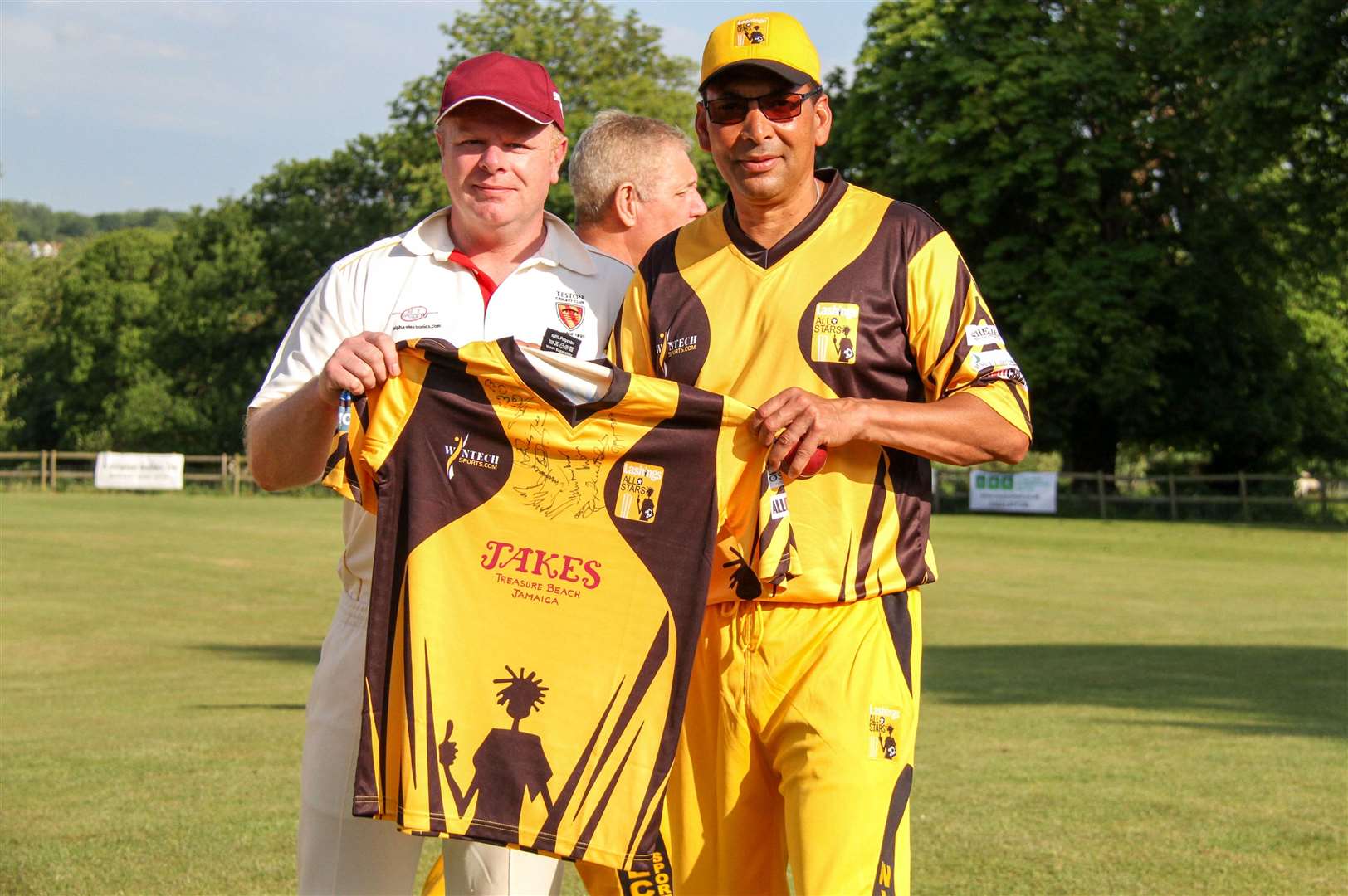 Steve Coley, left, being presented by ex-England bowler Phil de Freitas with his man-of-the-match shirt in June 2015. Picture: Teston Cricket Club