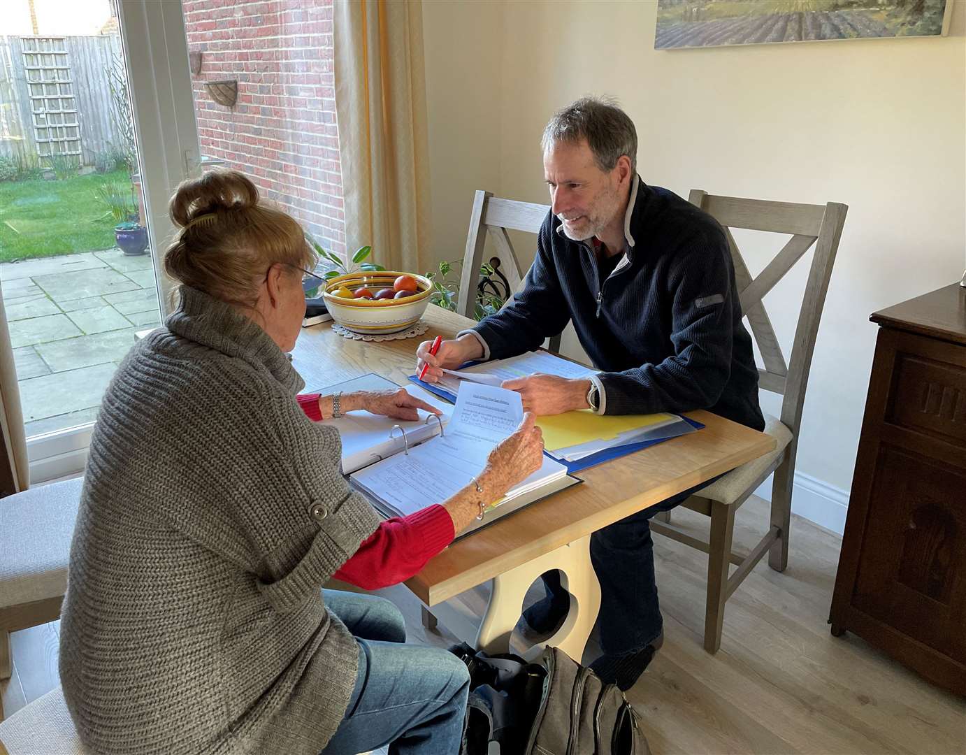 Duncan Edwards taking a witness statement from a local resident