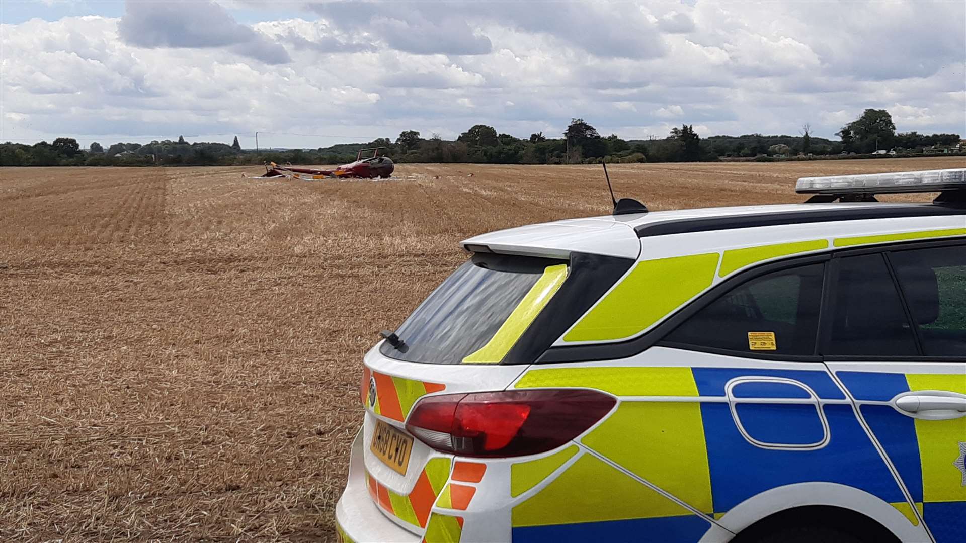 Police at the scene of the crash, on July 26