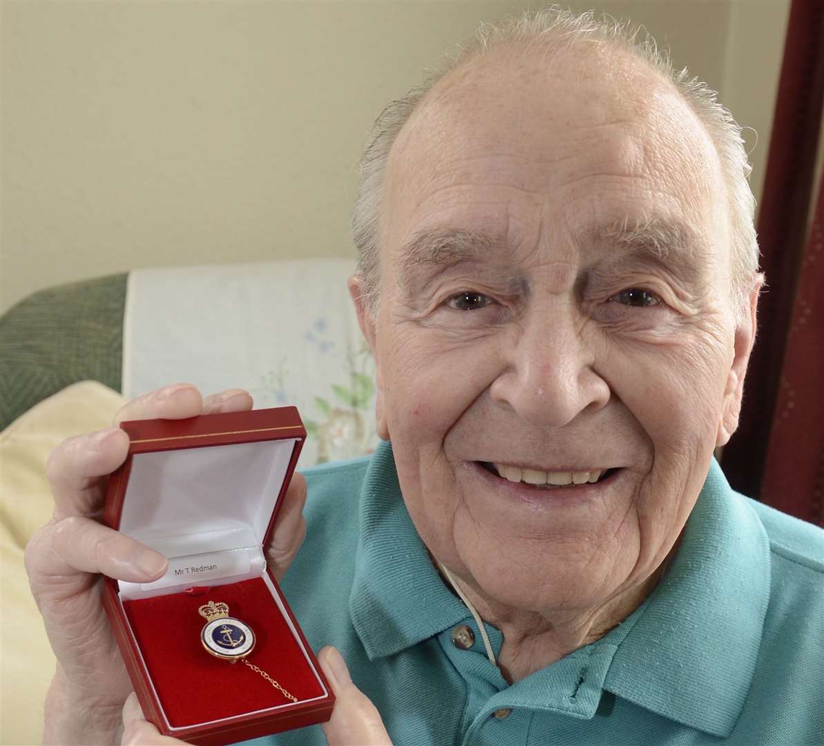 The late Sheppey coastguard Tom Redman of Banner Way, Halfway, with his gold badge for services to the RNLI. Picture: Chris Davey