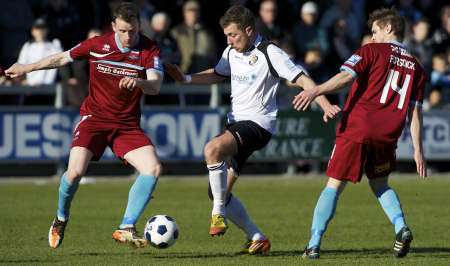 Ryan Hayes tries to get between two Nuneaton defenders