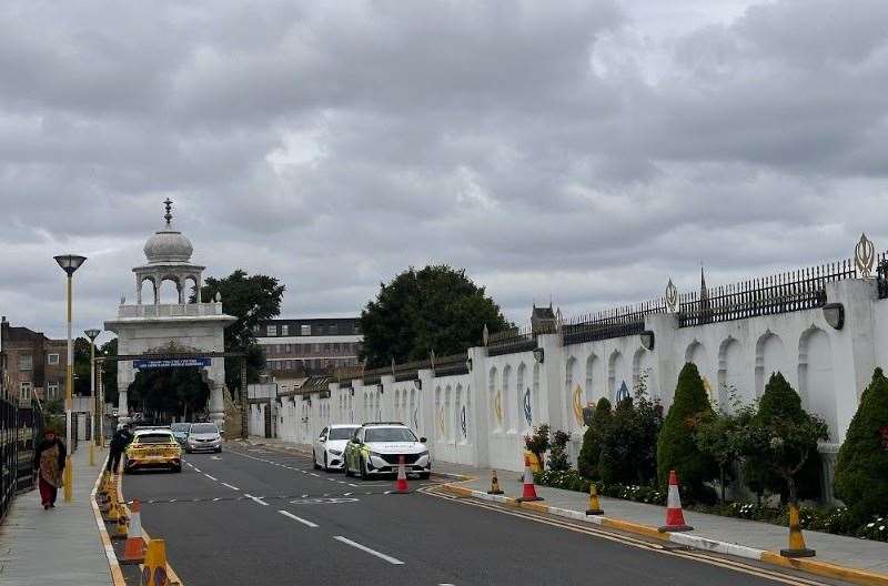 Police remain outside the Guru Nanak Darbar Gurdwara in Gravesend following the attack