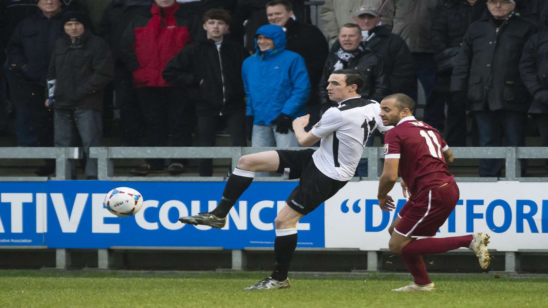 Danny Harris knocks the ball inside watched by his former team-mate Luke Daley Picture: Andy Payton