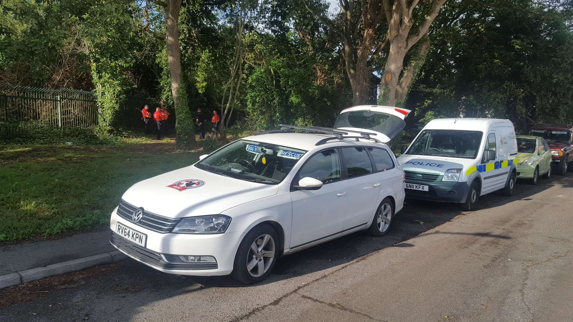 A number of emergency services vehicles parked in Dickens Avenue, Canterbury