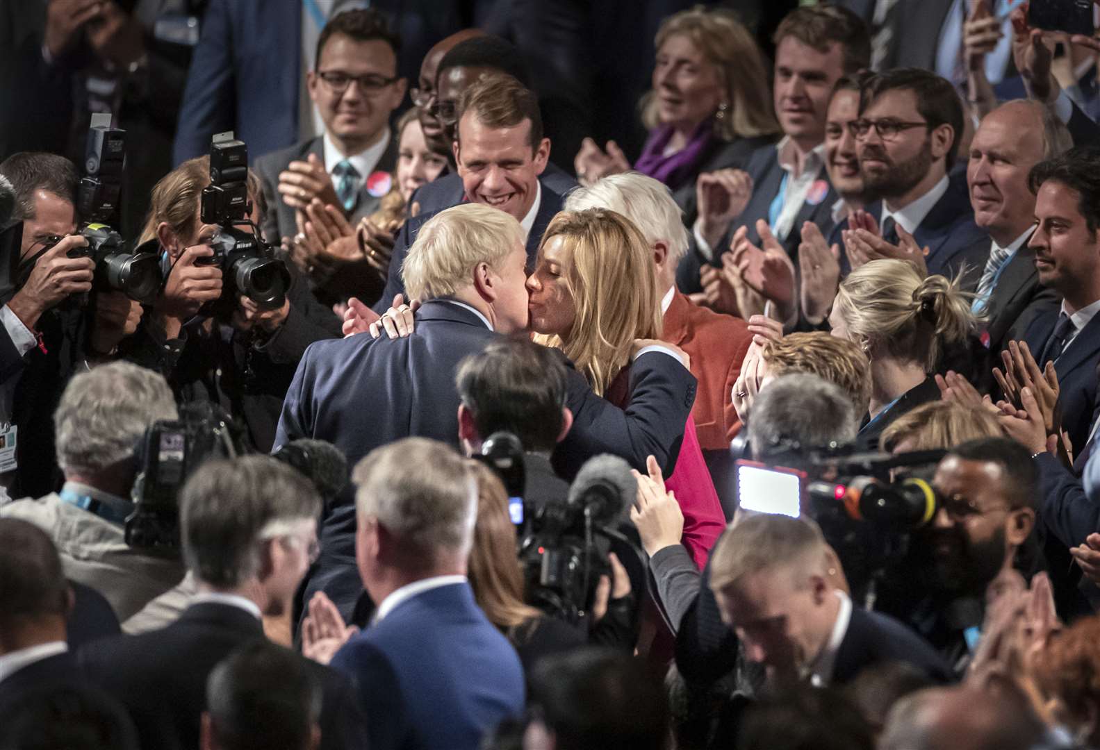 The couple embrace in front of the crowds at the Conservative Party Conference in Manchester (Danny Lawson/PA)