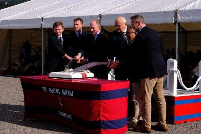 Senior offcers cut the birthday cake at the parade at Invicta Barracks in Maidstone. Photo: Mick Latter