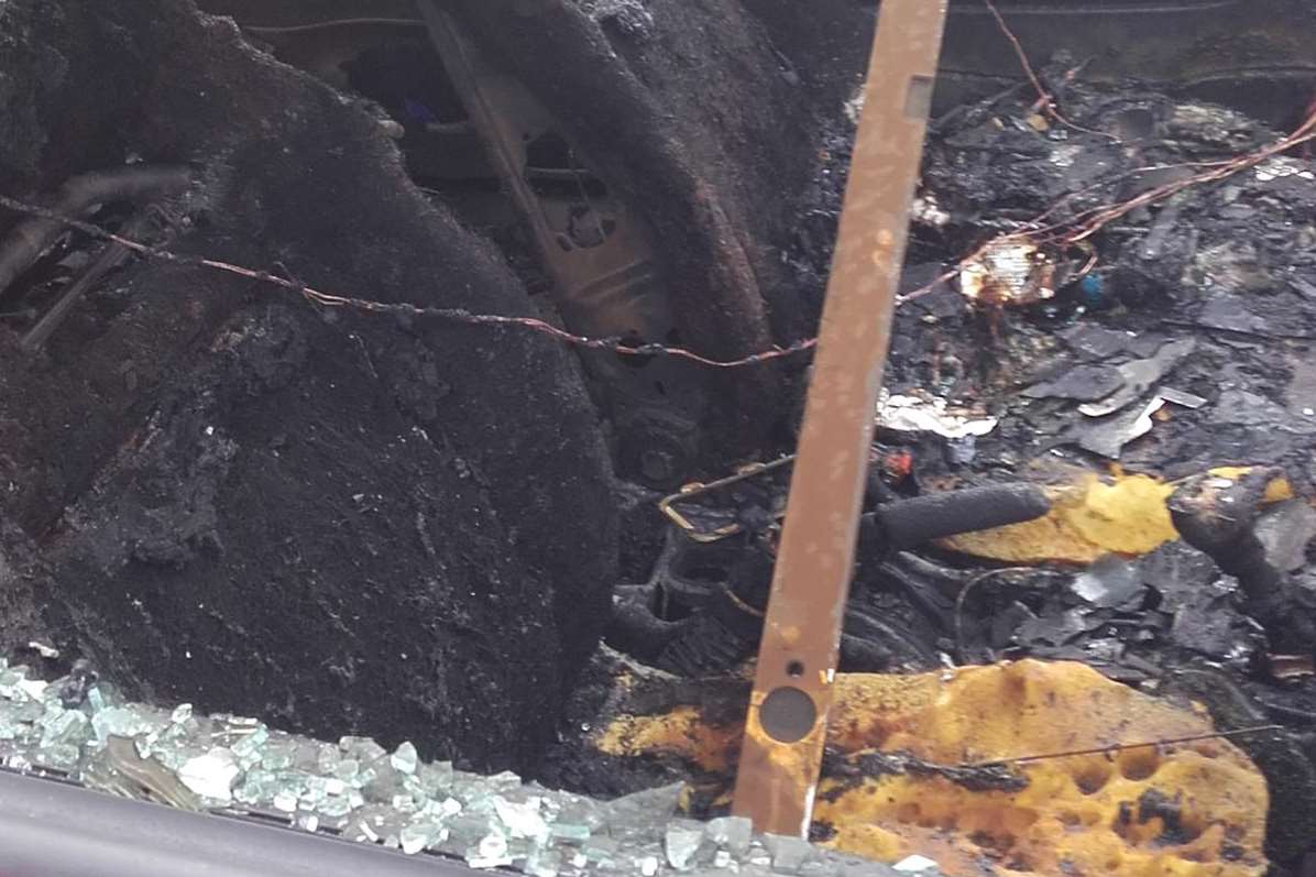 The charred car interior