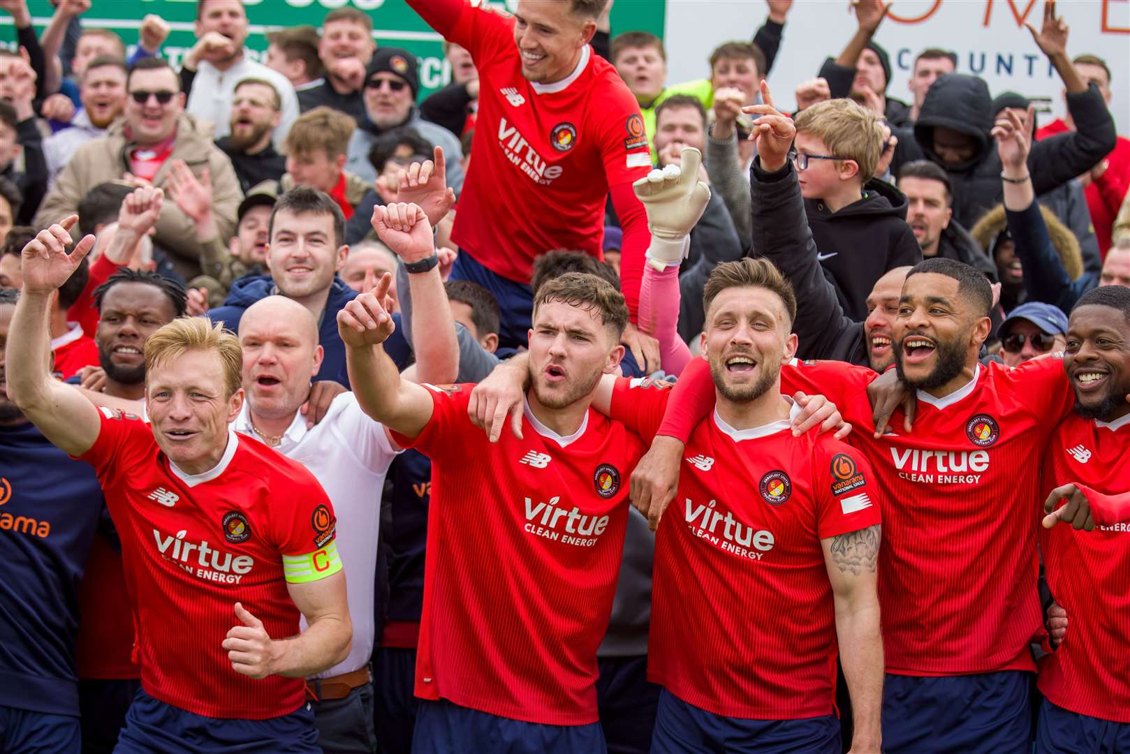 Josh Wright joins in the celebrations after Fleet’s draw at Boreham Wood kept them in the National League for another season. Picture: Ed Miller/EUFC