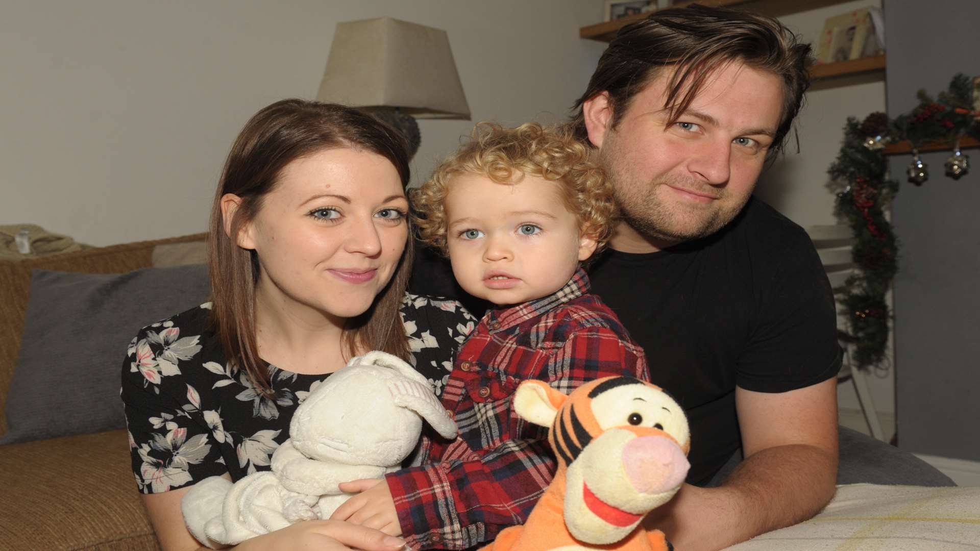 Noah with his parents Charlie Graves and Phil Buckenham.