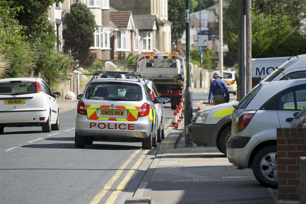 Police cars at the scene of the stabbing