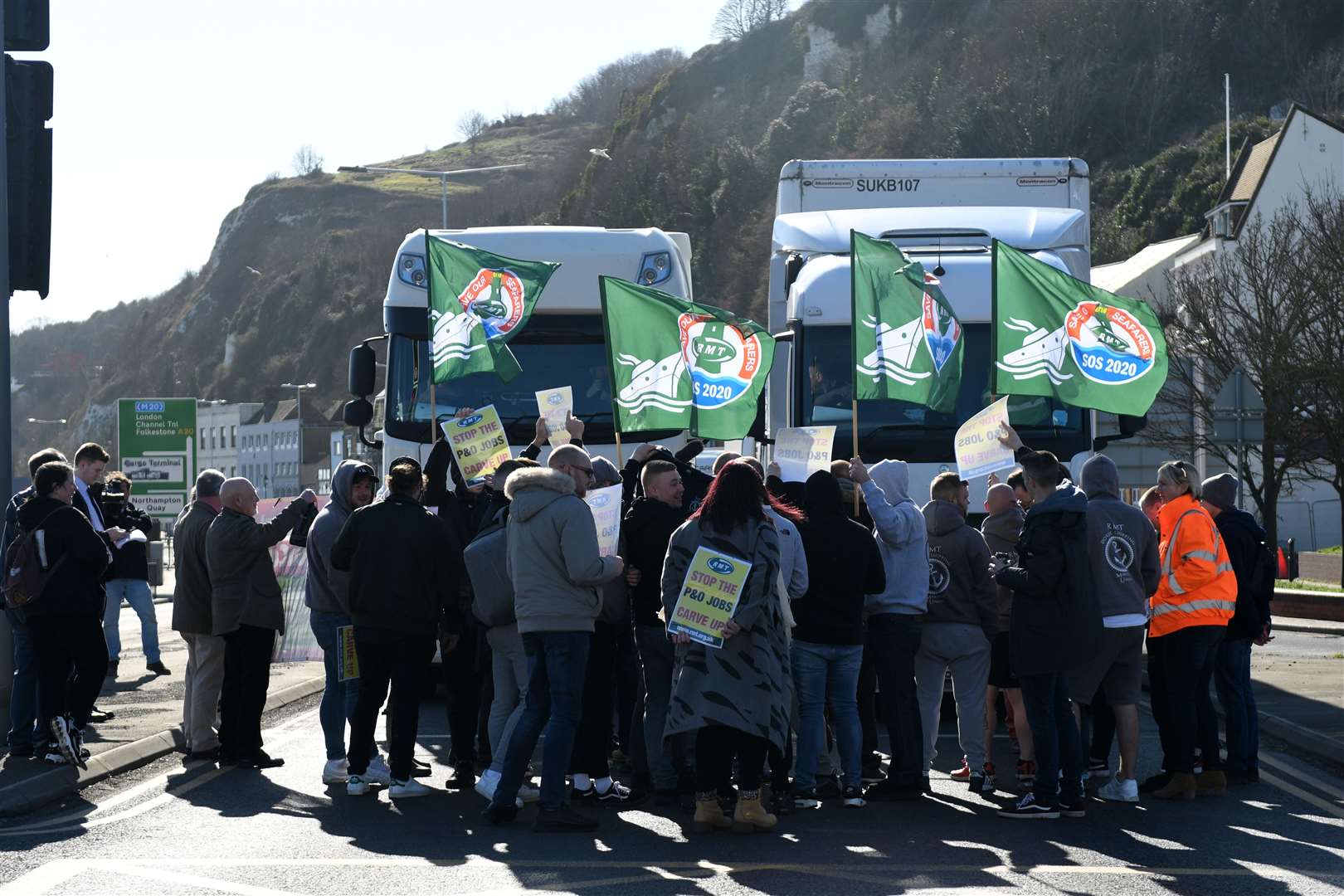 Sacked P&O staff member along with members of the RMT protest in Dover by blocking the main road heading towards the port. Picture: Barry Goodwin