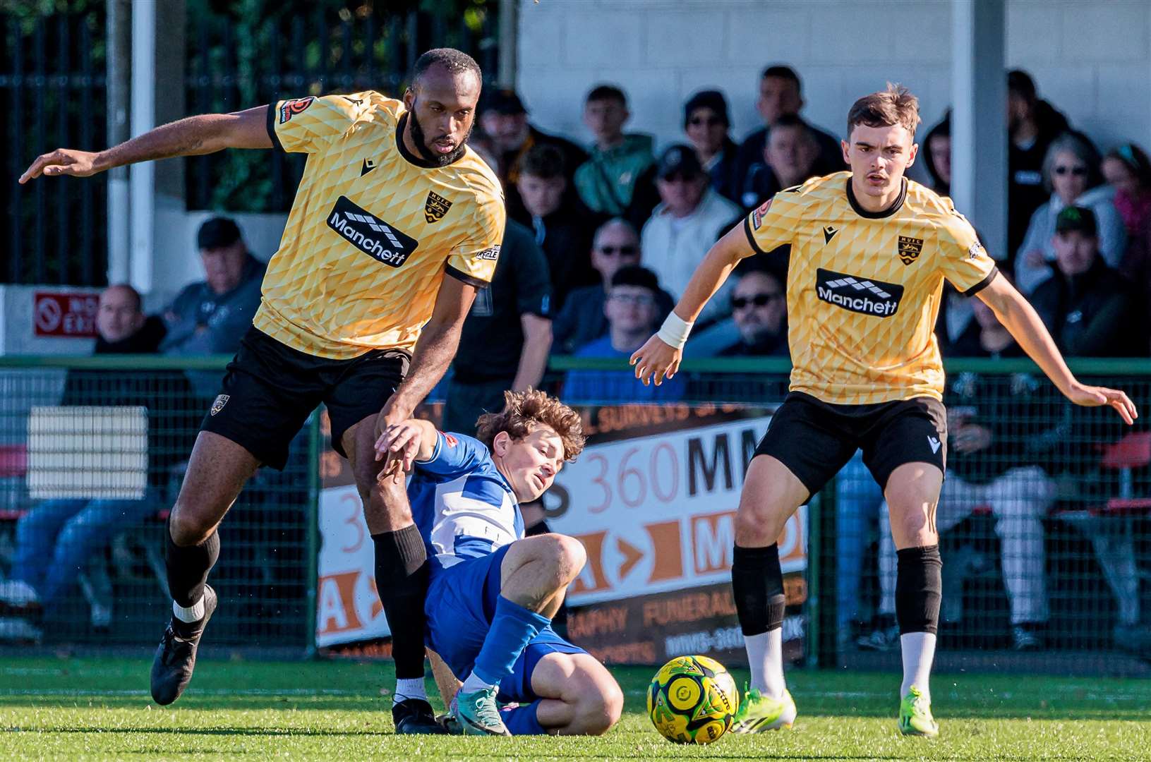 Herne Bay's Artem Kuchkov goes to ground under pressure from Reiss Greenidge. Picture: Helen Cooper