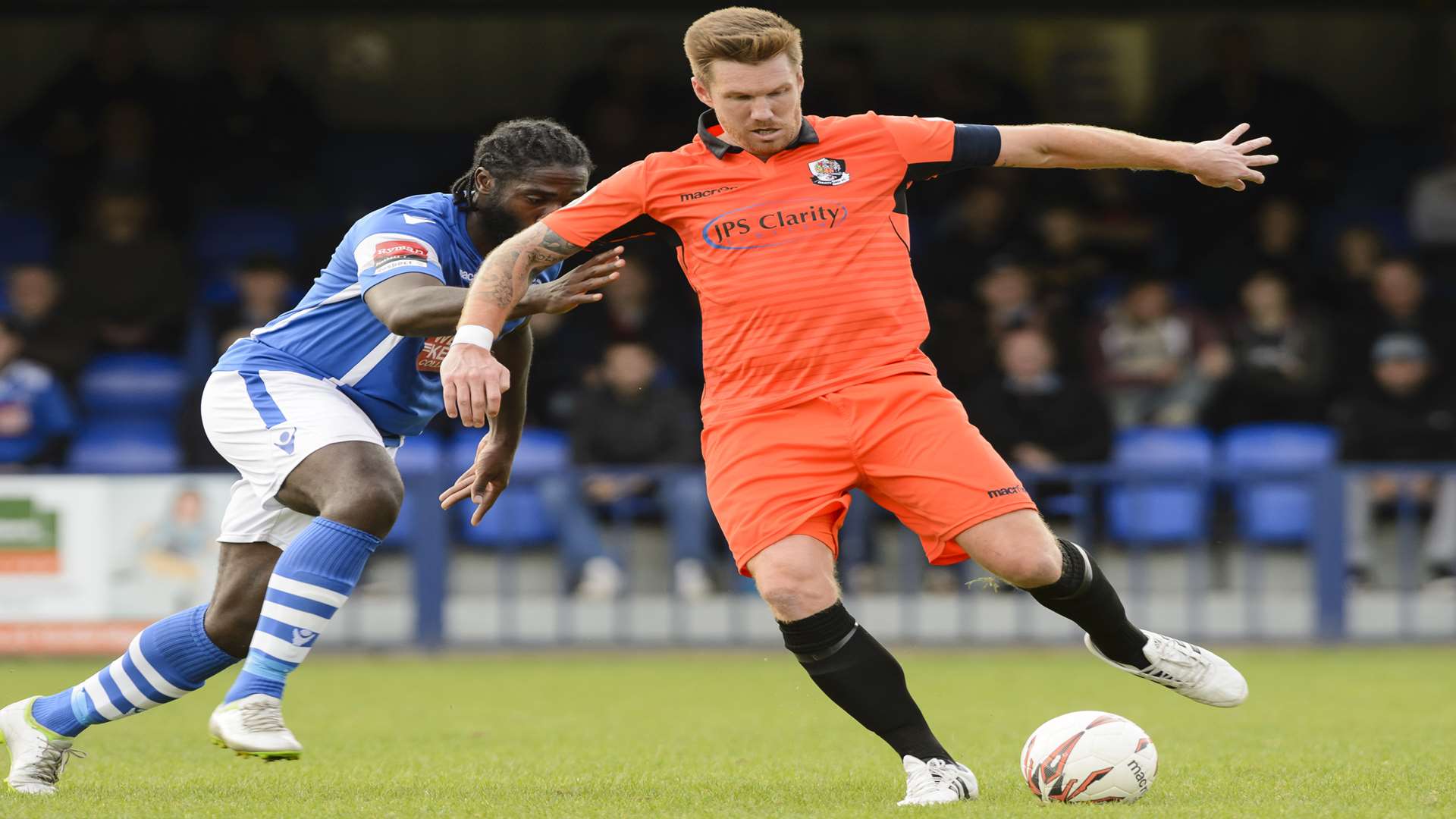 Dartford scorer Elliot Bradbrook chased by Craig Dundas Pic by Andy Payton