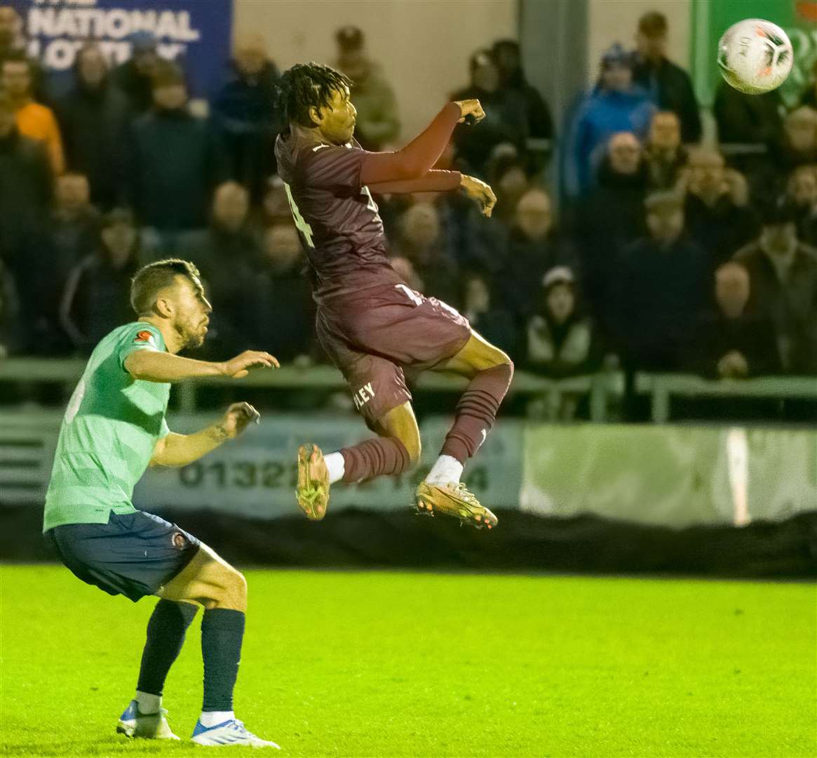 Dartford's Malachi Napa leaps into action ahead of Ebbsfleet's Greg Cundle on Sunday. Picture: Ed Miller/EUFC