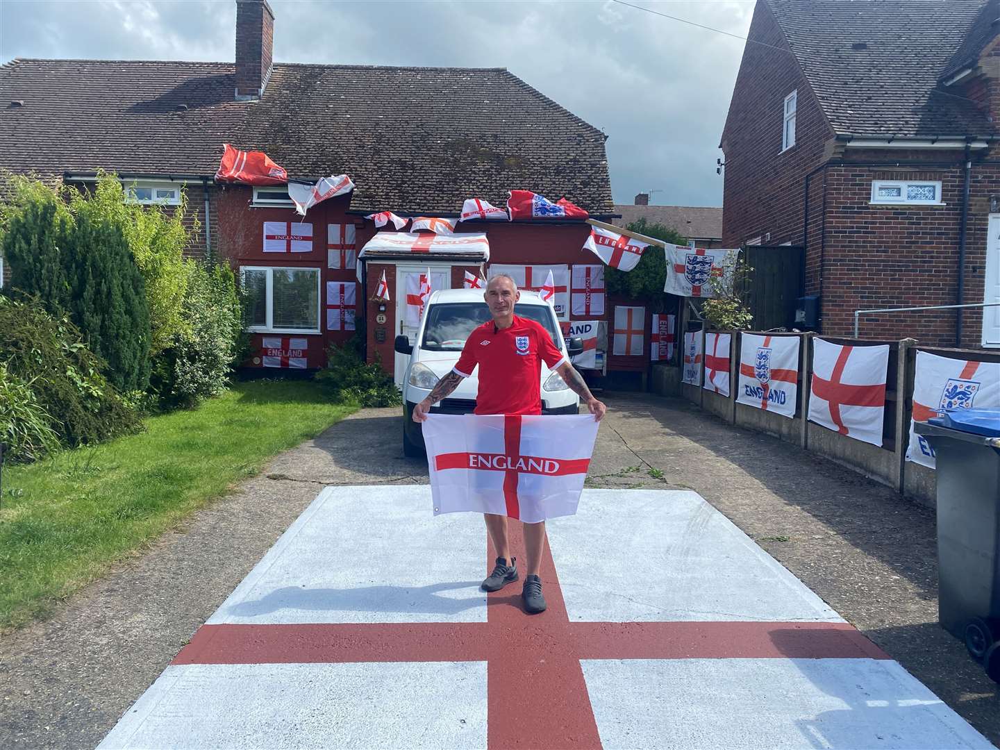 Martin Baker has painted the driveway of his Canterbury home with St George's Cross