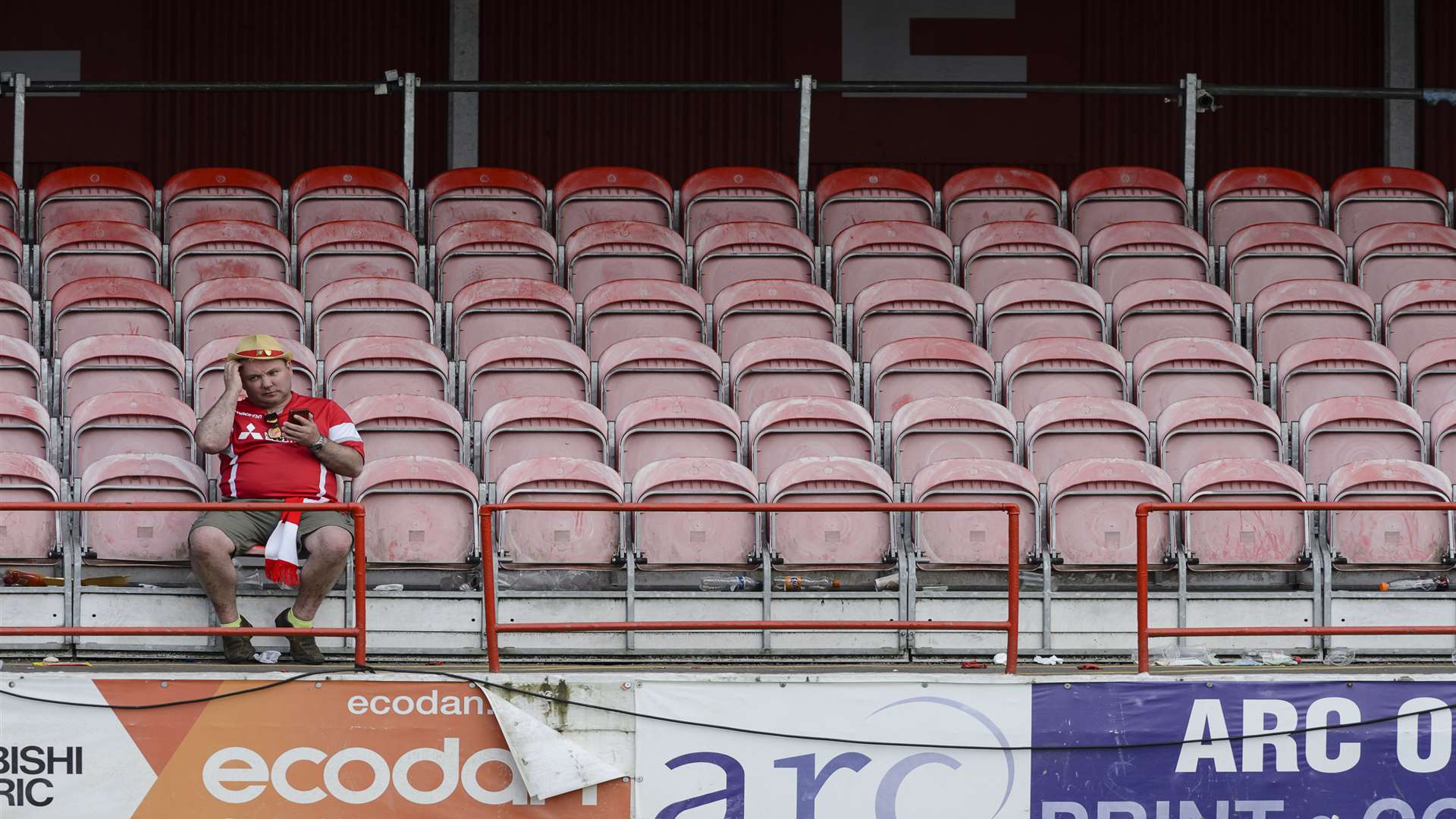 A sole Ebbsfleet fan sits in the stands, pondering what might have been. Picture: Andy Payton