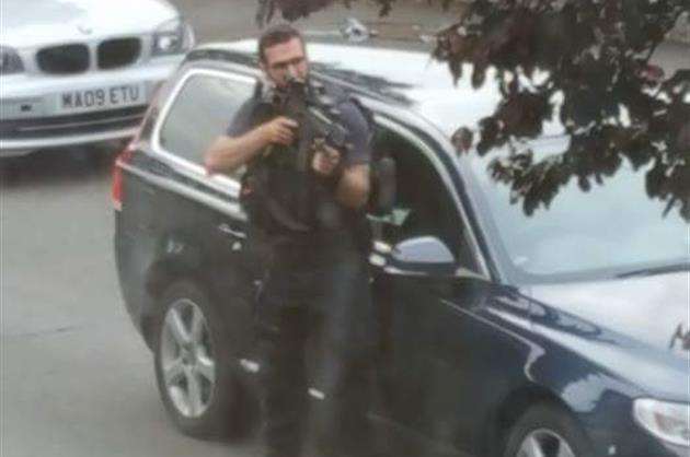 Armed police in Freeman Road, Northfleet.