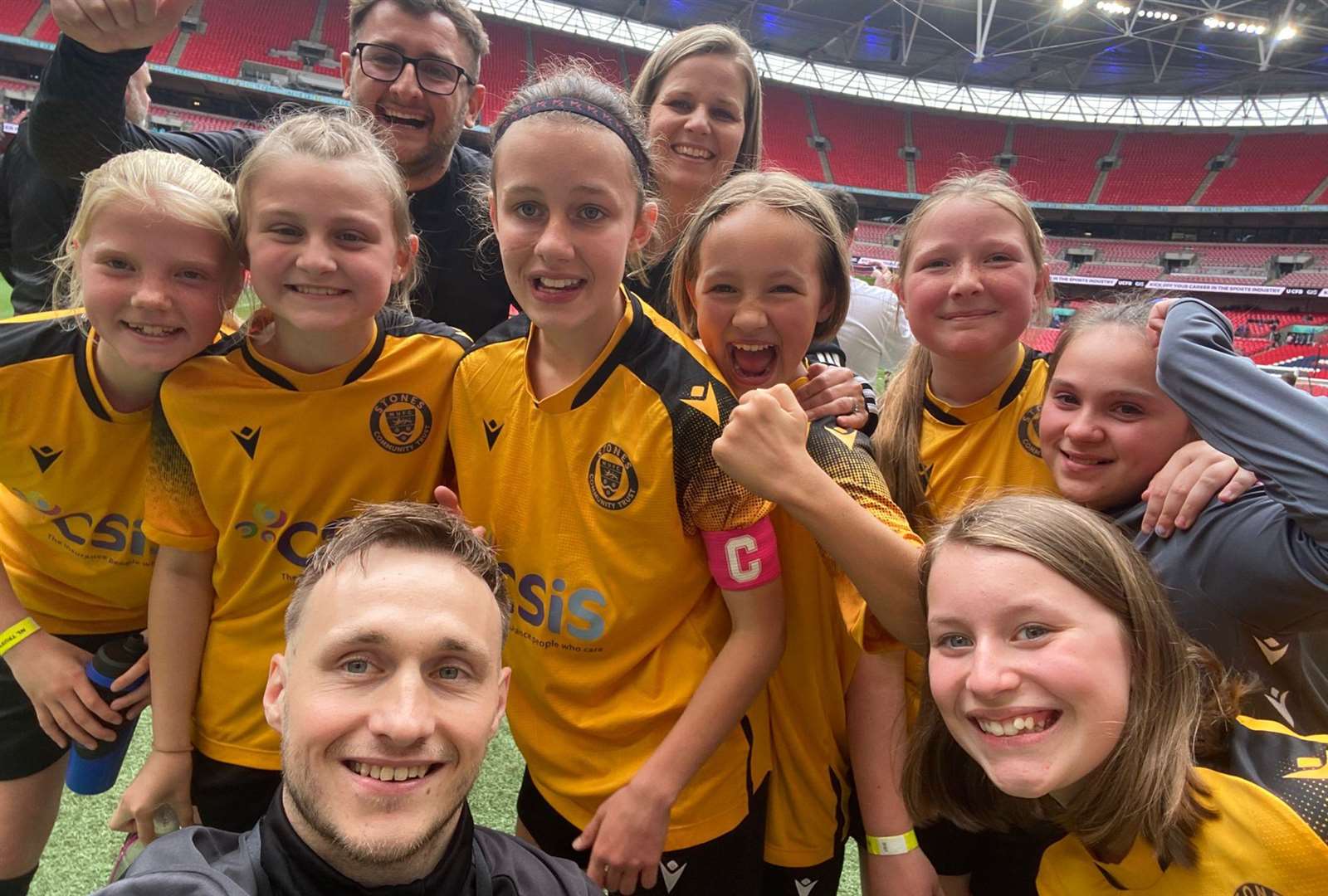 Palace Wood School, representing Maidstone United, celebrate Wembley glory in the National League Trust U11 Girls' Cup final.