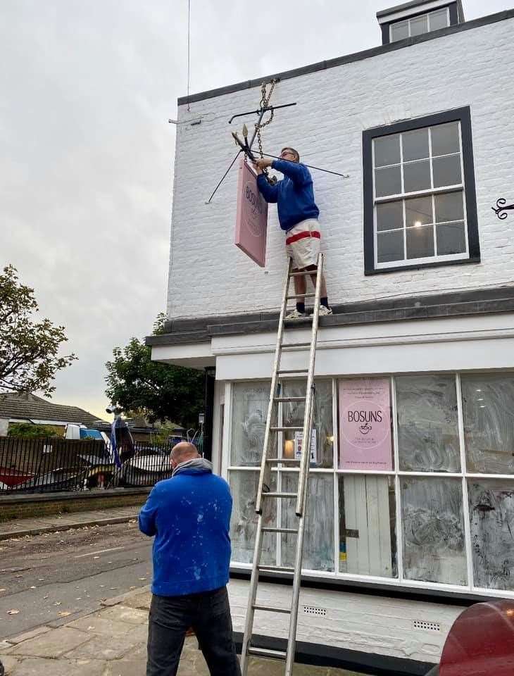 New 'pub' sign going up outside Bosuns tea room at Queenborough