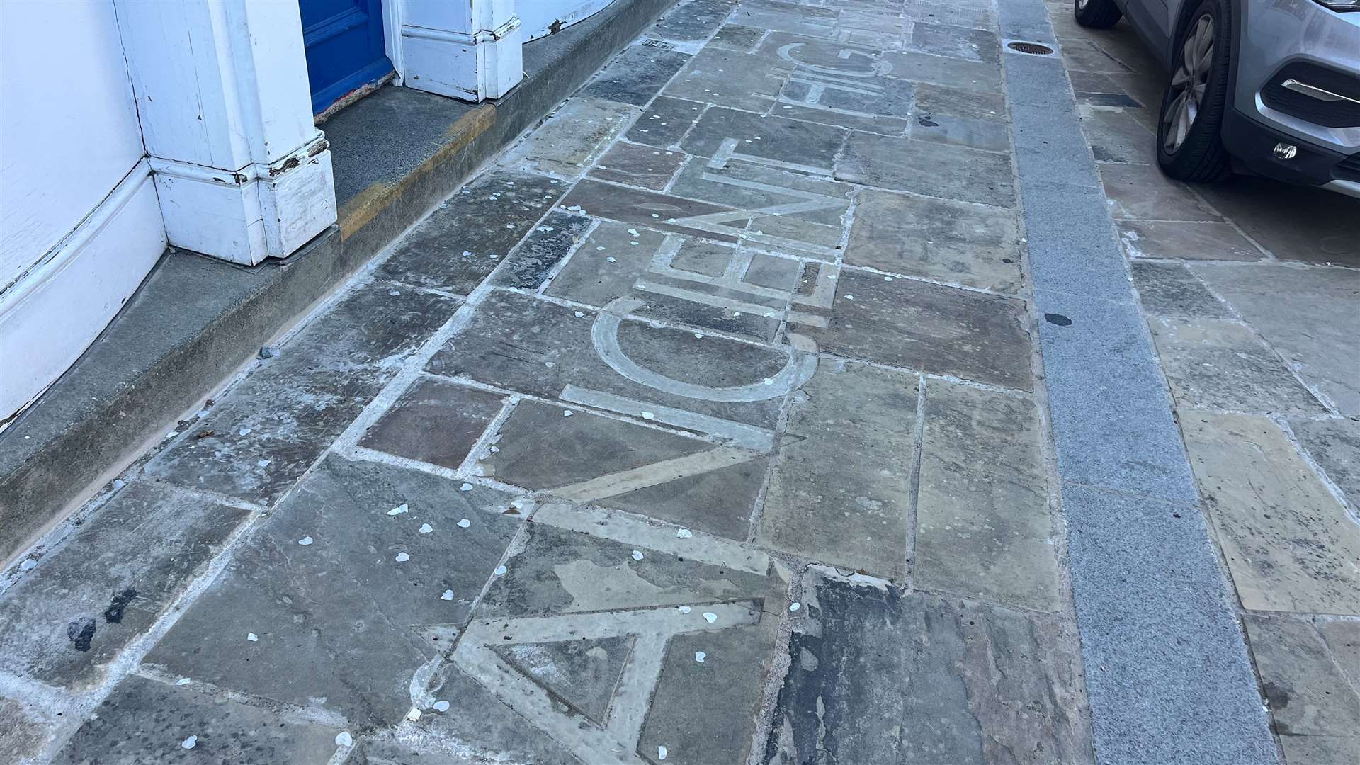 Some original writing remains in the stonework at Guildhall Square