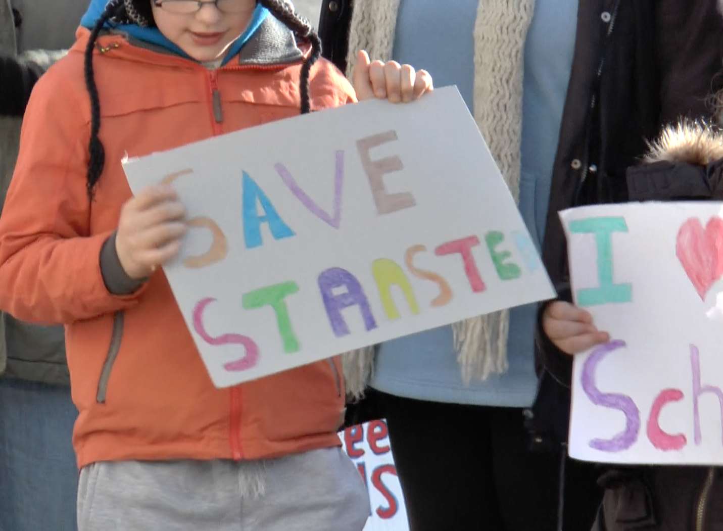 Parents and children waved placards