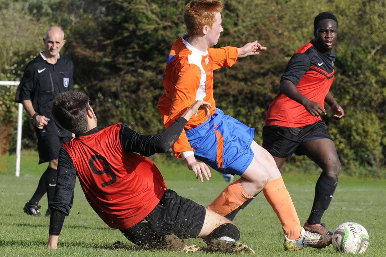 Rainham Kenilworth under-18s, red and black, challenge Cuxton 91 in Division 2 Picture: Ruth Cuerden