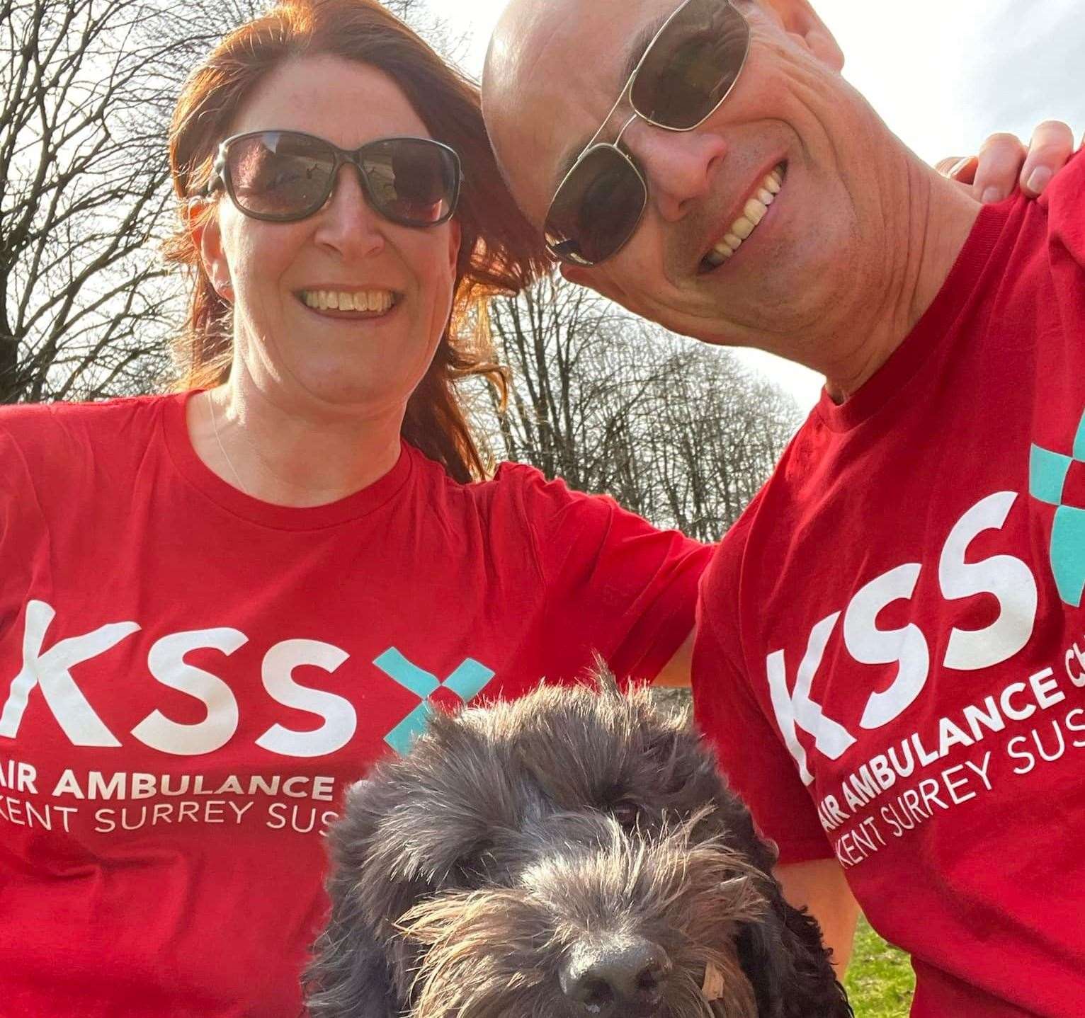 Former air ambulance patient Graham Beswick with his wife Sarah and Betty the sproodle