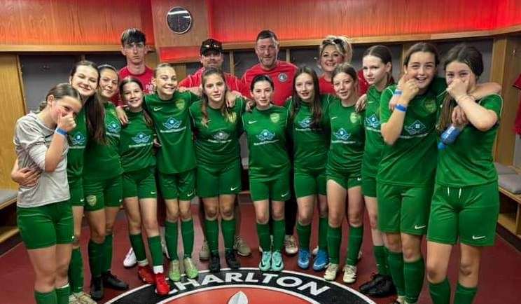 Lydd Grasshoppers under-13 girls' are all smiles in the changing rooms at the Valley Stadium