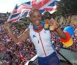 Kelly Holmes parades her two Olympic gold medals