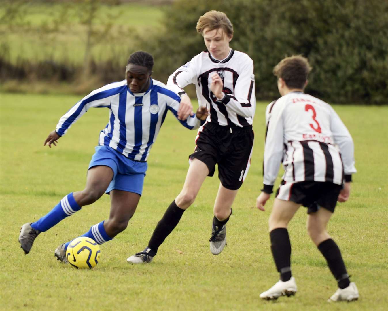 Chatham Riverside Rovers under-18s (blue) take on Milton & Fulston United under-18s. Picture: Barry Goodwin (42641111)