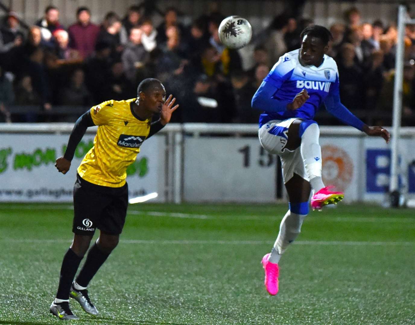 Maidstone skipper Gavin Hoyte heads clear against Gillingham on Tuesday night. Picture: Steve Terrell