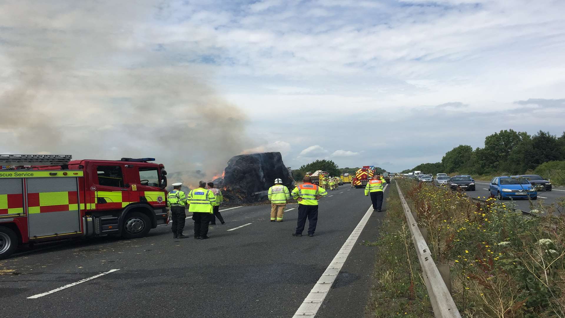 The lorry and its load continuing to smoulder. Picture: David Broad