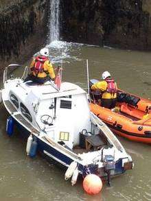 This sailing boat, next to the lifeboat, was found going round in circles on the River Medway and sparked a major river searc