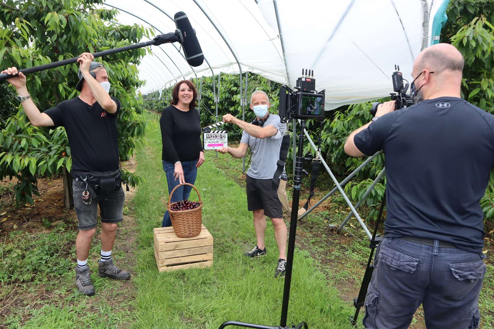 Sittingbourne cherry farmer Sarah Neaves at Little Sharsted Farm with ITV film crew for M&S advert with sound boom operator Jay Barnett, scriptwriter Anton Ezer and cameraman Rich Bennett. Picture: John Nurden