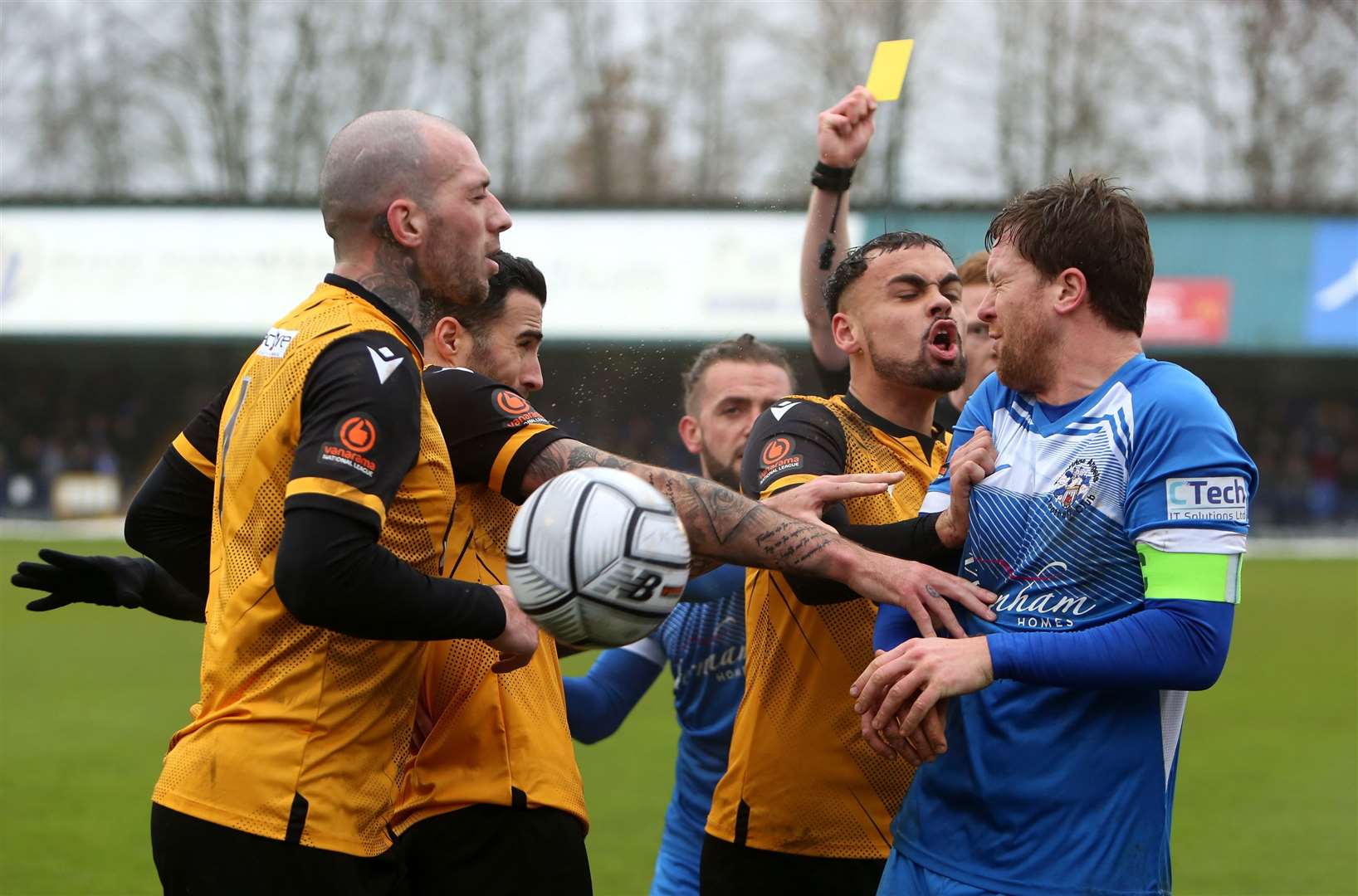 Tempers spill over as Maidstone goalscorer Michael Phillips gives Tonbridge skipper Sonny Miles a shove Picture: Dave Couldridge