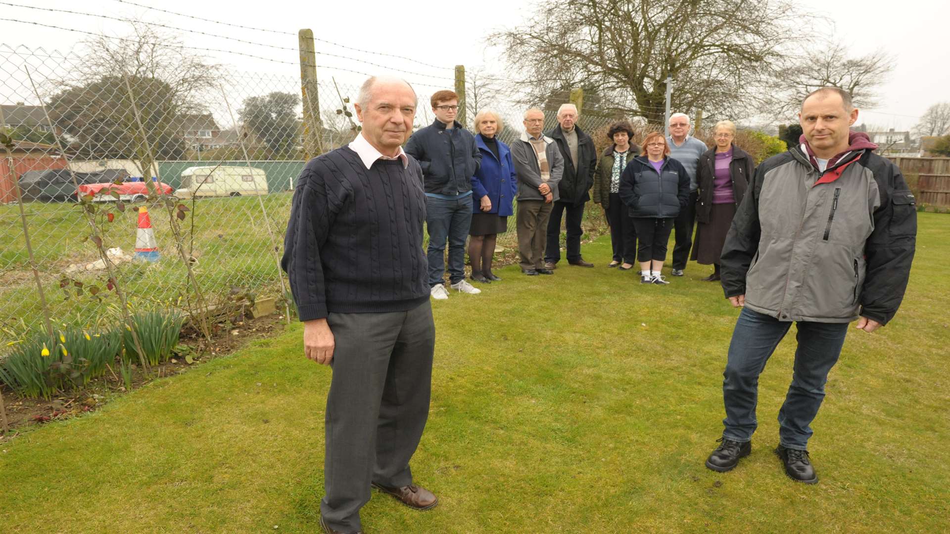 Mike Blake and Ian Bates with residents, who are objecting to the nursing home