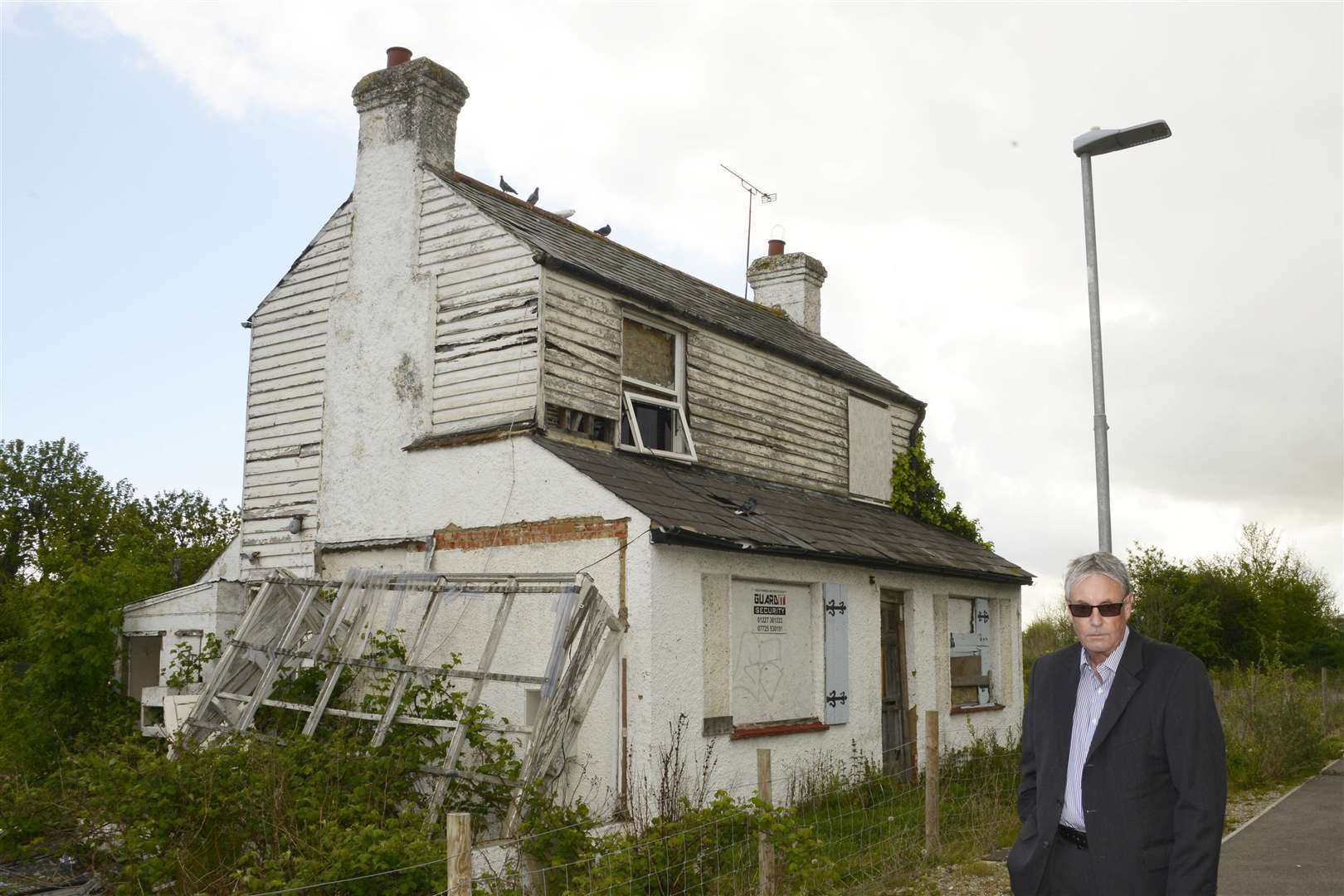 Mr Morris says the house is boarded up, had parts of it “pulled down” and its windows smashed