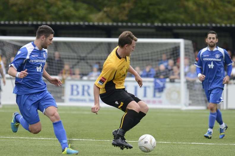 Maidstone United's Alex Flisher takes on Lowestoft (Pic: Martin Apps)